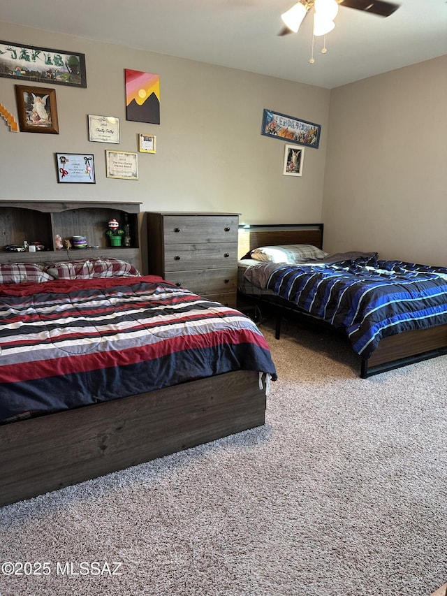 carpeted bedroom featuring a ceiling fan