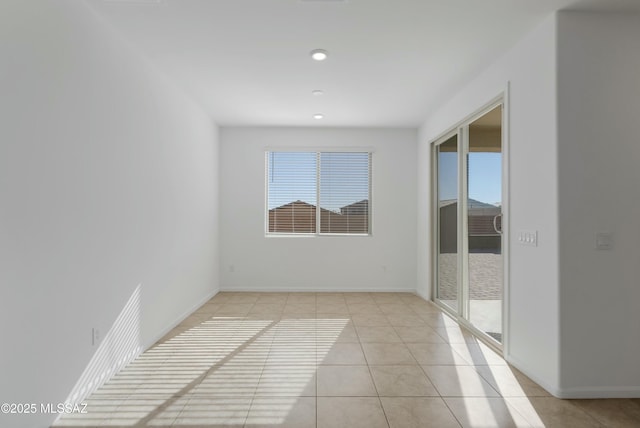 unfurnished room featuring light tile patterned floors