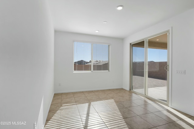 view of tiled spare room