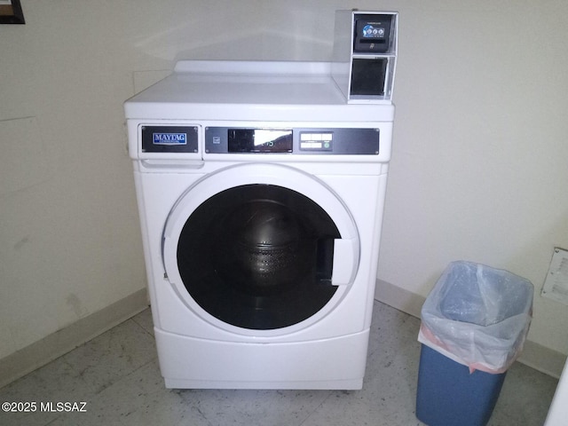 clothes washing area with washer / dryer