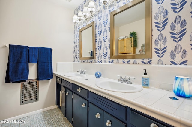 bathroom with tile patterned flooring and vanity