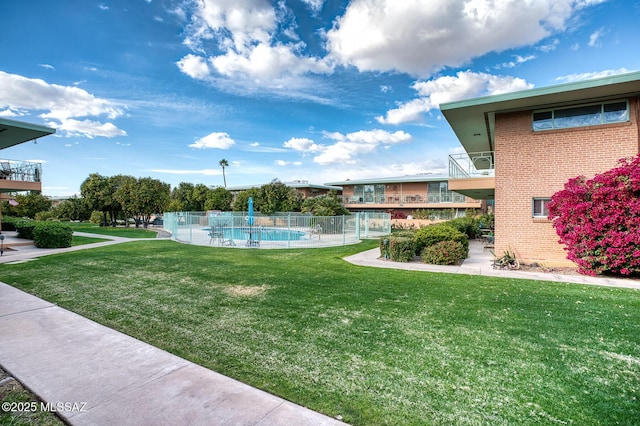 view of yard featuring a fenced in pool