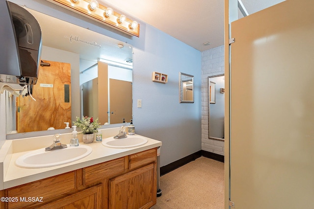 bathroom with vanity and walk in shower