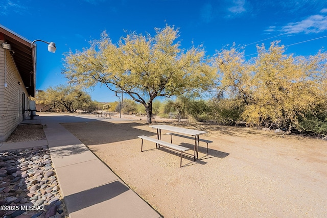 view of property's community featuring a patio area