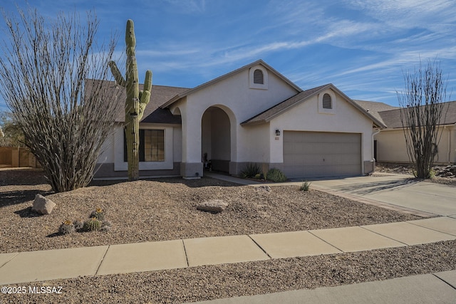 ranch-style house featuring a garage