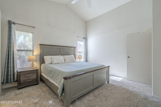 bedroom with light carpet, high vaulted ceiling, and ceiling fan