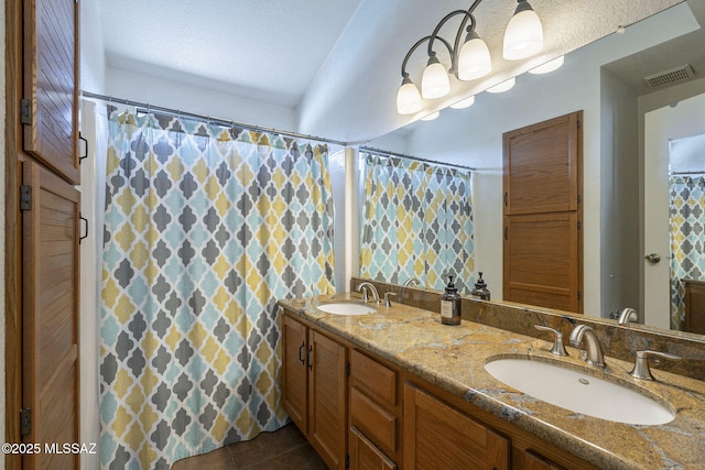 bathroom with vanity and tile patterned floors