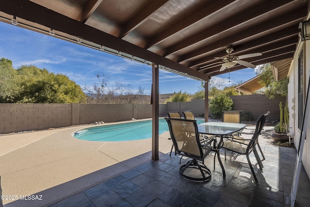 view of pool featuring ceiling fan and a patio