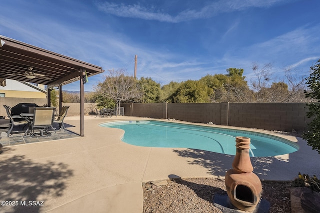 view of pool with a patio area and ceiling fan