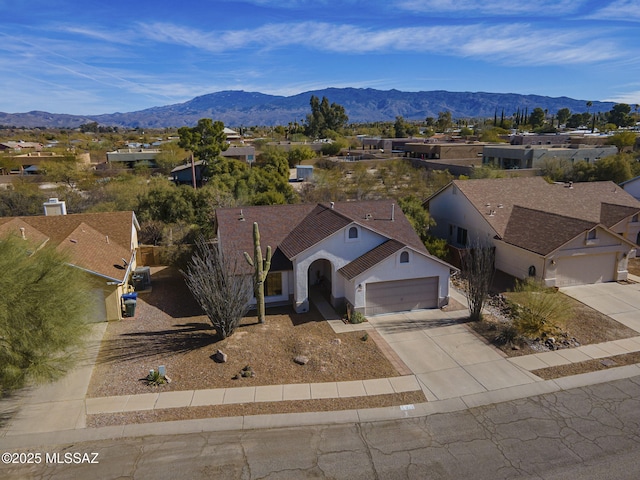 birds eye view of property with a mountain view