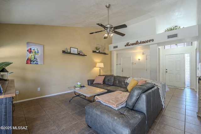 tiled living room featuring high vaulted ceiling and ceiling fan