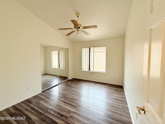 unfurnished room with dark hardwood / wood-style floors, high vaulted ceiling, and ceiling fan