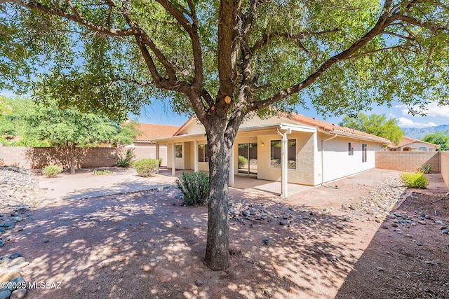 rear view of property with a patio area