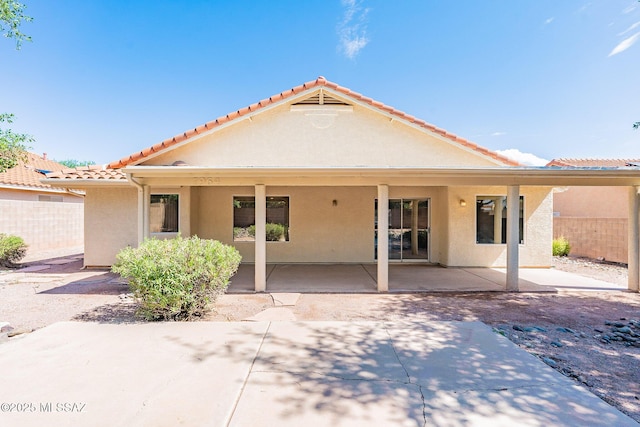 back of property featuring a patio area