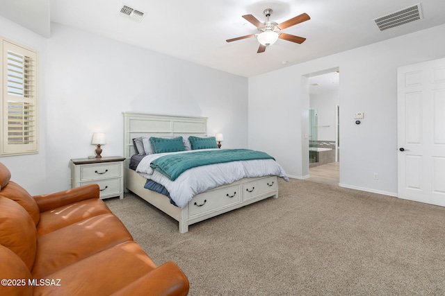 carpeted bedroom featuring ceiling fan and ensuite bathroom