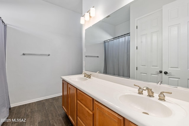 bathroom with walk in shower and vanity