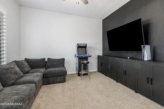 living room featuring light carpet and ceiling fan