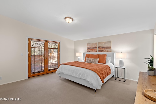 carpeted bedroom with vaulted ceiling and french doors