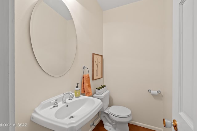 bathroom with toilet and sink