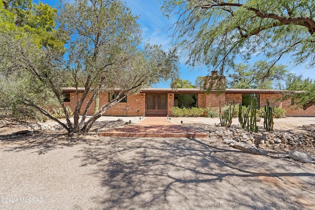 ranch-style house with french doors