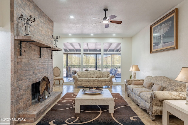 5613 N Calle Del Marques, Tucson, AZ 85718 - living area featuring recessed lighting, a fireplace, a textured ceiling, and ceiling fan