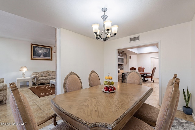 dining area with a notable chandelier