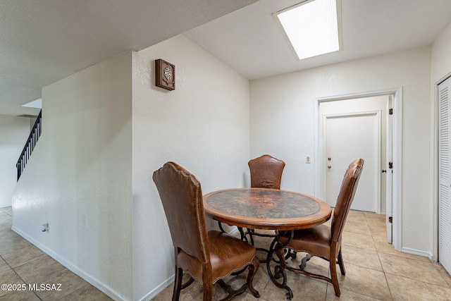 dining area with light tile patterned floors