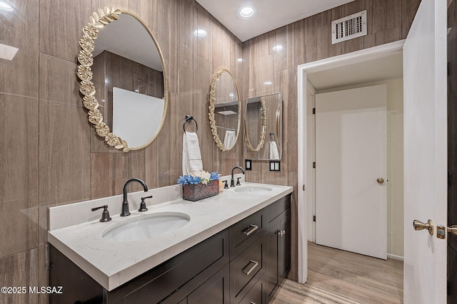 bathroom featuring vanity and wood-type flooring