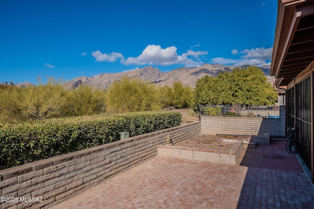 view of patio / terrace with a mountain view