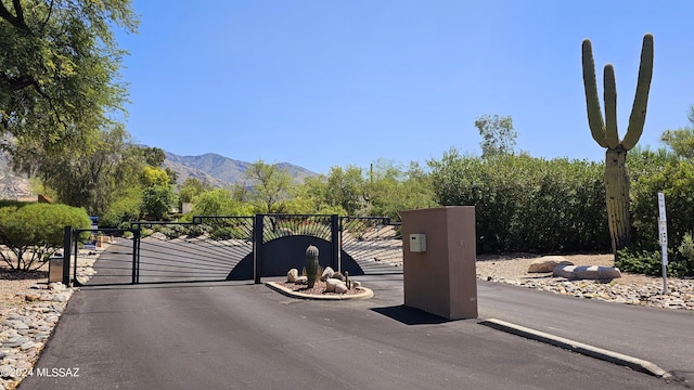 view of gate featuring a mountain view