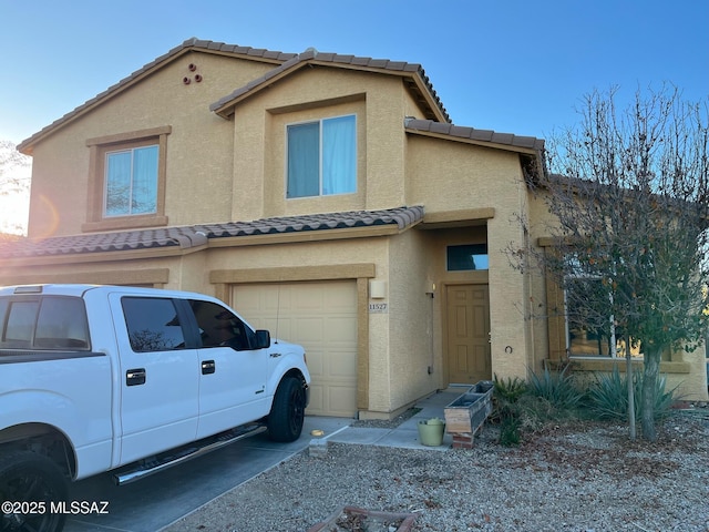 view of front of property with a garage