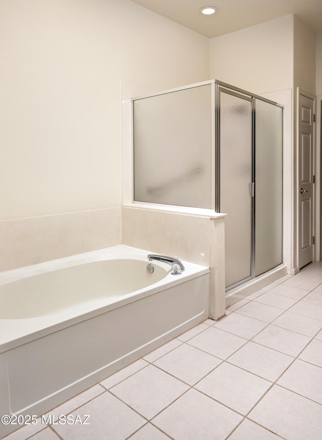 bathroom with tile patterned floors and plus walk in shower