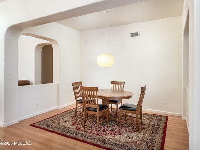 dining room with hardwood / wood-style flooring