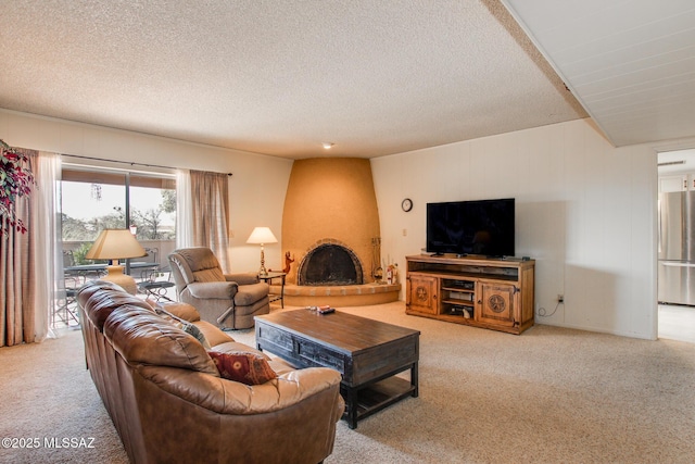 carpeted living room with a large fireplace and a textured ceiling