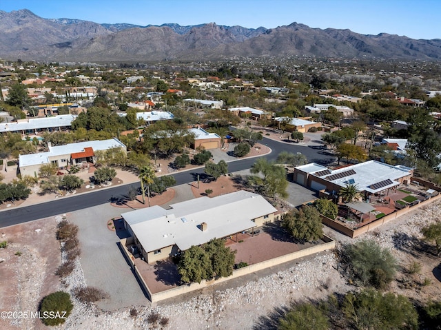 birds eye view of property with a mountain view