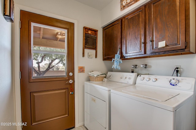 laundry area with cabinets and independent washer and dryer