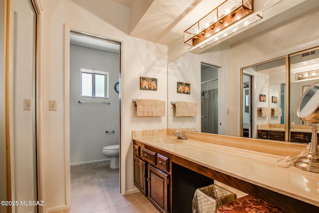 bathroom with walk in shower, vanity, toilet, and tile patterned flooring