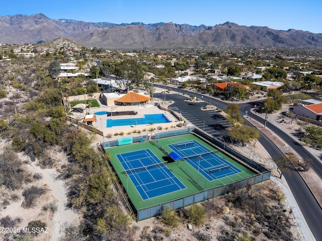 birds eye view of property with a mountain view