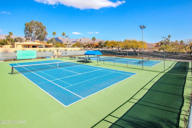 view of sport court with a mountain view