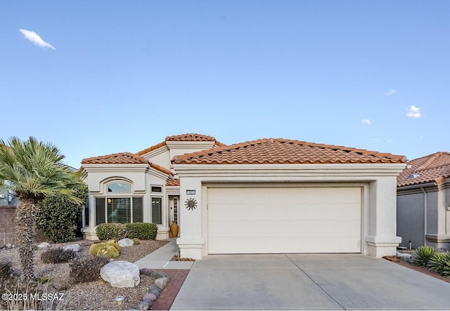 mediterranean / spanish home featuring a garage