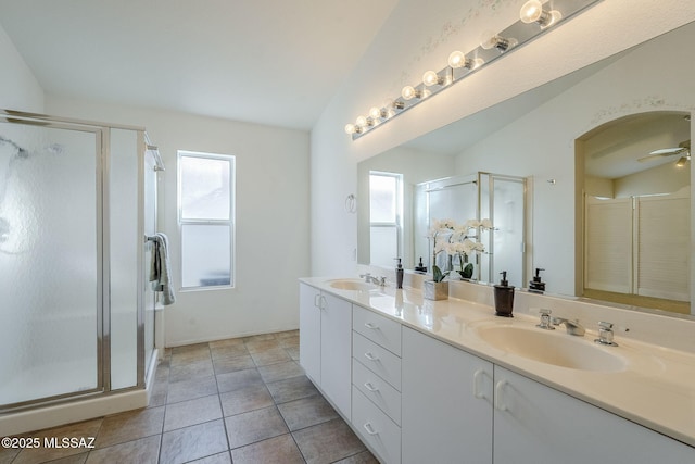 bathroom featuring vaulted ceiling, ceiling fan, an enclosed shower, and vanity