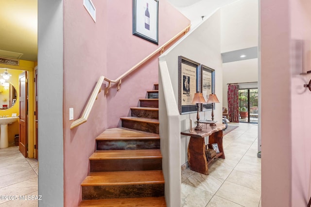 staircase with tile patterned floors