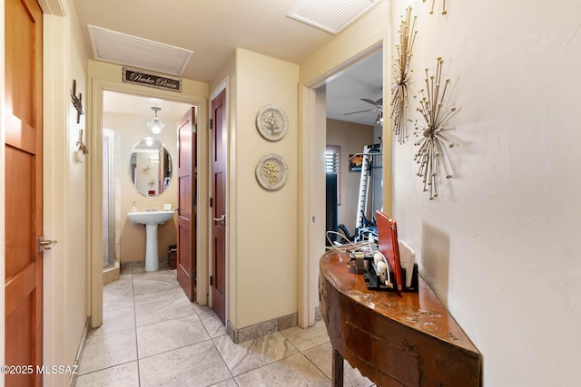 hallway with light tile patterned flooring