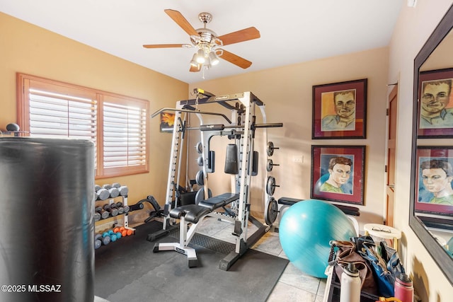 exercise room with ceiling fan