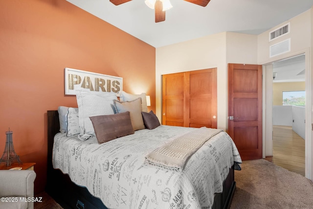 bedroom featuring carpet, ceiling fan, and a closet