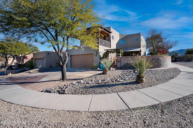 view of front of house featuring a balcony and a garage