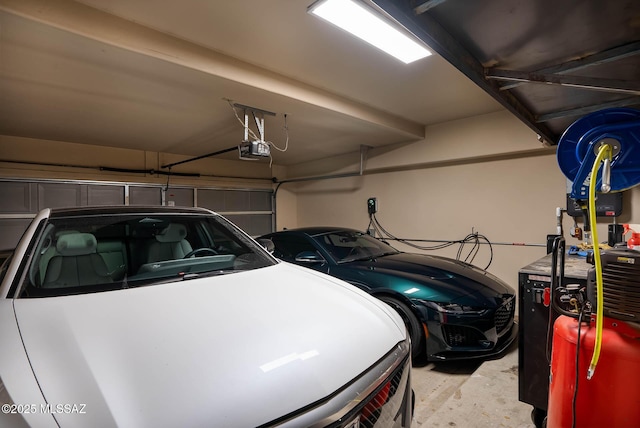 garage featuring a garage door opener