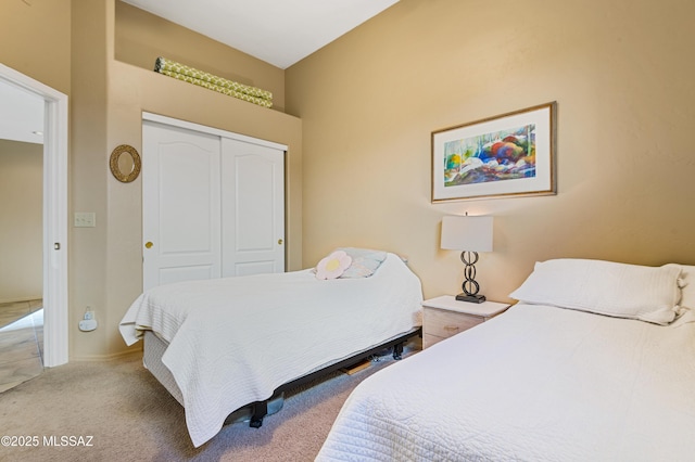 carpeted bedroom with a closet