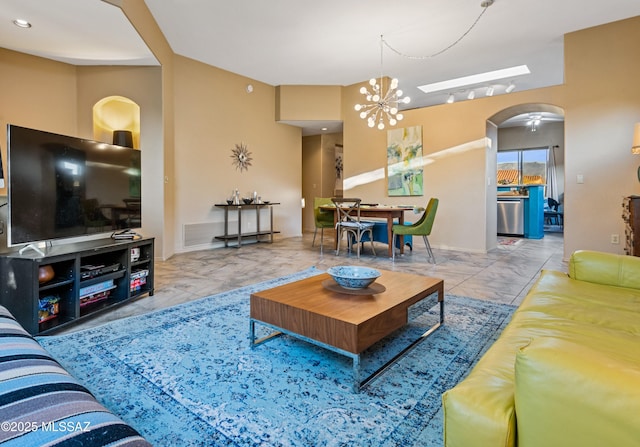 living room featuring an inviting chandelier