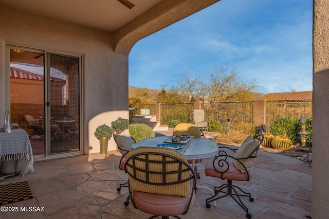 view of patio featuring ceiling fan